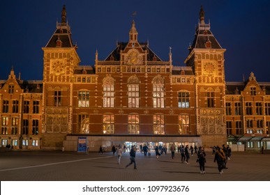 Amsterdam May 18 2018 - Travelors Leaving And Entering The Central Train Station Of Amsterdam At Night