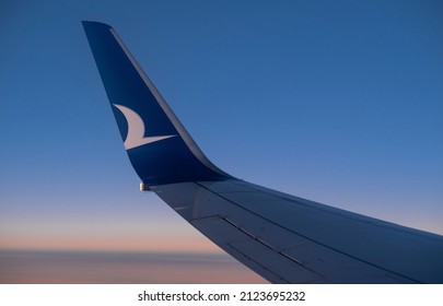 Amsterdam, Netherlands, 02.12.2022: Airplane Travel, Airplane Ride At Sunset, Going On Vacation And Traveling. Anadolu Jet. Boeing Planes. Airplane Wings, Bird Logos