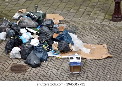 Amsterdam, Netherlands 03282021: garbage on the street - Shutterstock ID 1945019731