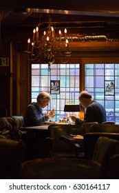 Amsterdam, The Netherlands - 11 April 2017 - Elderly European couple enjoy their dining together at a romantic restaurant in Amsterdam, The Netherlands on April 11, 2017. - Shutterstock ID 630164117