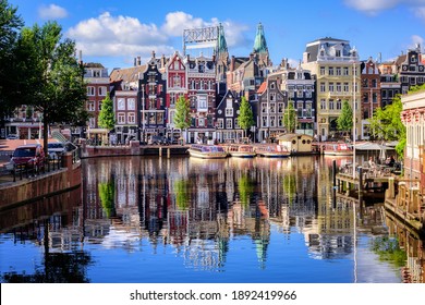 Amsterdam, Netherlands - 12 July 2020: The Old town center on Amstel river in Amsterdam city, North Holland,  is the main tourist attraction of the Netherlands