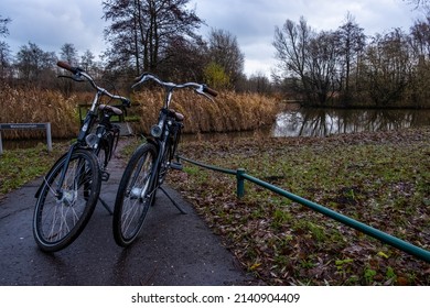 amsterdam, netherlands - 12-15-2019: picture ot two bikes next to an auxiliary road during the winter, no trademark or identifiable person visible.