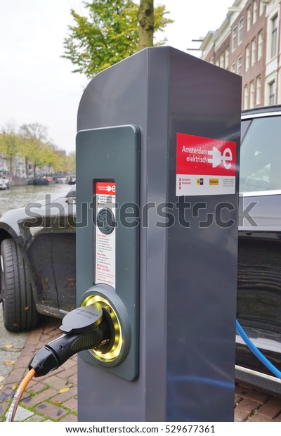 AMSTERDAM, NETHERLANDS -16 NOV 2016- Electric car\
charging stations in the streets of Amsterdam, which has the second\
largest fleet of plug-in electric vehicles per capita in the world\
after Norway. 