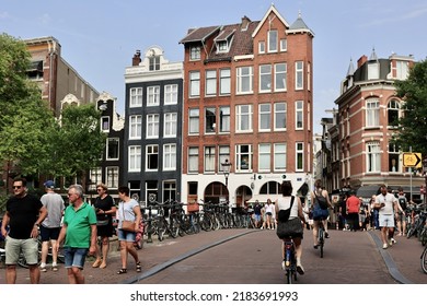 Amsterdam, The Netherlands - 18 June 2022: Everyday Life Of Tourists And Townspeople In Amsterdam, Netherlands. Typical Street View In Amsterdam, Holland.