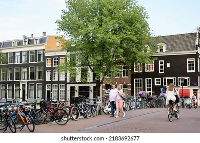 Amsterdam, The Netherlands - 18 June 2022: Everyday Life Of Tourists And Townspeople In Amsterdam, Netherlands. Typical Street View In Amsterdam, Holland.