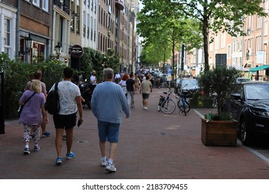 Amsterdam, The Netherlands - 18 June 2022: Everyday Life Of Tourists And Townspeople In Amsterdam, Netherlands. Typical Street View In Amsterdam, Holland.