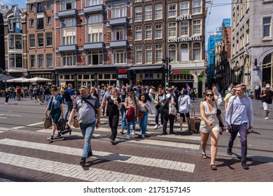 Amsterdam, The Netherlands - 21 June 2022: Many People Crossing The Street In Amsterdam