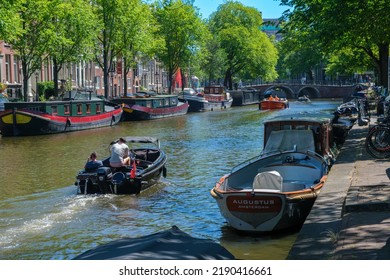 Amsterdam, The Netherlands - 21 June 2022: Houseboats On Amsterdam Canal In Summer