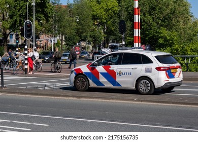 Amsterdam, The Netherlands - 22 June 2022: Police Car At A Stop Light