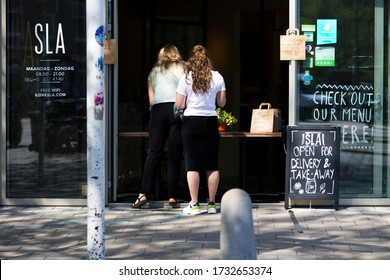 Amsterdam, The Netherlands - APRIL 2020: The City Is Virtually Empty And Abandoned As A Result Of The Corona Virus Covid 19 And People Keeping Their Distance. 