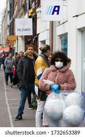 Amsterdam, The Netherlands - APRIL 2020: The City Is Virtually Empty And Abandoned As A Result Of The Corona Virus Covid 19 And People Keeping Their Distance. 