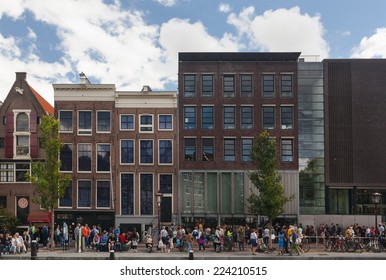 AMSTERDAM - NETHERLANDS: AUGUST 13, 2014: People waiting in line in front of the Anne Frank House, one of Amsterdam's most popular tourist attraction.