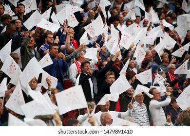 Amsterdam, Netherlands - August 13, 2019. Ajax Fans Wave Flags Before A Soccer Match Between Ajax AFC And PAOK FC.