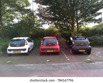 AMSTERDAM; THE NETHERLANDS - AUGUST 20, 2017: Three White, Red, And Black Models Of Citroen C1 Parked Side By Side In The Street