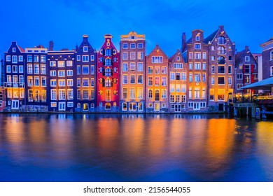 Amsterdam, Netherlands. Colorful Houses At The Damrak Canal.