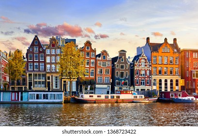 Amsterdam Netherlands dancing houses over river Amstel landmark in old european city spring landscape.