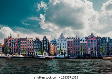 Amsterdam Netherlands dancing houses over river Amstel landmark in old european city spring landscape. - Shutterstock ID 1583871355