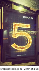 AMSTERDAM, THE NETHERLANDS - DEC 20, 2014: Chanel Ad For Chanel No.5 Fragrance Advertising Campaign At The Rembrandt Square Tram Stop. Filtered Toned Image In Instagram Look.