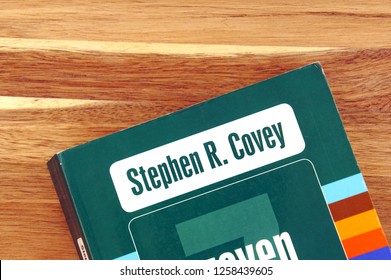 Amsterdam, The Netherlands - December 14, 2018: Book Cover Of The Seven Habits Of Highly Effective People By Stephen Covey Against A Wooden Background.