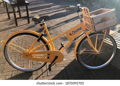 Amsterdam, the Netherlands, December 2020. Dutch delivery bike for lunch and warm drinks as chocolate milk, brand Chocomel.