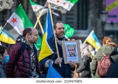 Amsterdam, Netherlands, February 6, 2022 Big protest against Putin and the war in Ukraine at Dam Square, Amsterdam. Syrian and Ukrainian people demonstrate together.