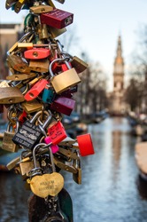 Amsterdam, The Netherlands - January 08, 2016: Locks Left As Promises To Loved Ones On The Kloveniersburgwal/Staalstraat Bridge.