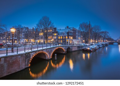 AMSTERDAM, NETHERLANDS - JANUARY 22, 2019: Winter Wonder Land in the Dutch Capital Amsterdam with very rare snowfall on the dutch bikes and canals