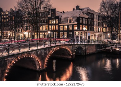 AMSTERDAM, NETHERLANDS - JANUARY 22, 2019: Winter Wonder Land in the Dutch Capital Amsterdam with very rare snowfall on the dutch bikes and canals