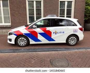 Amsterdam, The Netherlands - July 15, 2019:  Dutch National Police Car Parked By The Side Of The Road. Nobody In The Vehicle.