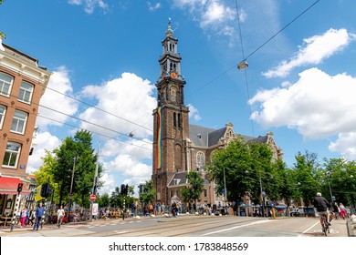 AMSTERDAM, THE NETHERLANDS - July 26, 2020: Rainbow Flag Hanging Outside Westerkerk Tower, Due To Coronavirus Disease (COVID-19) Scourge The 25th Edition Of Pride In The Netherlands Cannot Take Place.