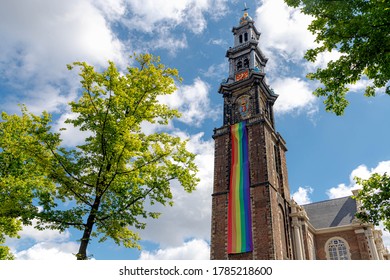 AMSTERDAM, THE NETHERLANDS - July 26, 2020: Rainbow Flag Hanging Outside Westerkerk Tower, Due To Coronavirus Disease (COVID-19) Scourge The 25th Edition Of Pride In The Netherlands Cannot Take Place.