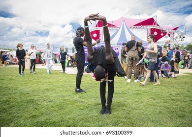 Amsterdam, The Netherlands - July 29 2017: Black Man Stretching Before His Performance At Milkshake Festival In Westerpark