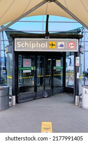 Amsterdam, The Netherlands - July 7 2022: Rotating Door And Signage At The Front Of Departures Amsterdam Schiphol Airport