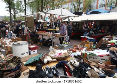AMSTERDAM, NETHERLANDS - JULY 8, 2017: People visit Waterlooplein Market in Amsterdam, Netherlands. The popular flea market has up to 300 stalls.