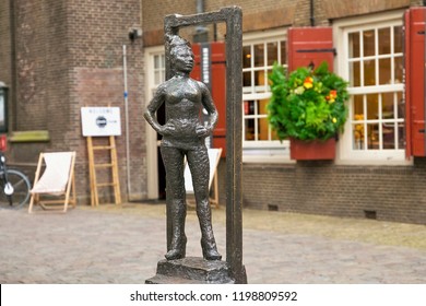 AMSTERDAM, NETHERLANDS - JUNE 25, 2017: Bronze statue of Belle on a granite pedestal with inscription - Respect sex workers all over the world. Was built in 2007 near the Oude Kerk church.