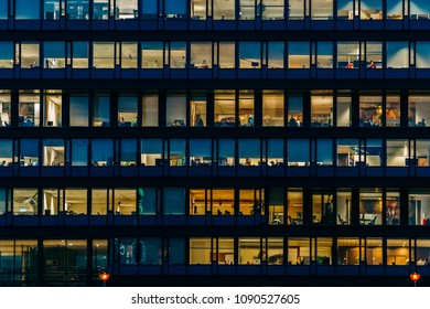 AMSTERDAM, NETHERLANDS - NOVEMBER 08, 2017: Busy Office Buildings During Night In Amsterdam City