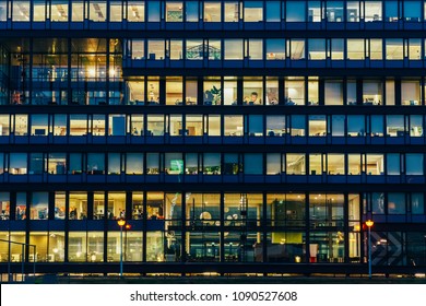 AMSTERDAM, NETHERLANDS - NOVEMBER 08, 2017: Busy Office Buildings During Night In Amsterdam City