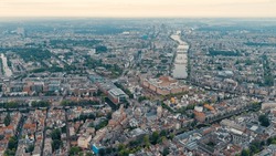 Amsterdam, Netherlands. Panorama Of The City In The Morning In Cloudy Weather. View Of The Amstel River With Locks, Aerial View  