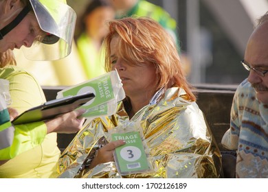 AMSTERDAM, NETHERLANDS - Sep 24, 2011: A Female Victim Is Getting Triage Class Assigned By A Paramedic During Disaster Exercise