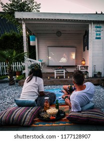 Amsterdam Netherlands September 2018, People Looking Movie In The Garden, Garden Cinema Night At Home, People Self-isolation  Coronavirus Spreading