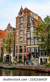 AMSTERDAM, NETHERLANDS - SEPTEMBER 25, 2017: Amsterdam City Center. Beautiful view of Amsterdam Canals with Bridge and typical Dutch Houses. Amsterdam, Netherlands.