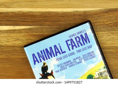 Amsterdam, The Netherlands - September 7, 2019: Part Of A DVD Movie Cover From George Orwell's Animal Farm Against A Wooden Background.