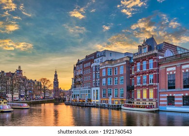 Amsterdam Netherlands, sunset city skyline of Dutch house at canal waterfront - Powered by Shutterstock