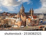 Amsterdam, Netherlands town cityscape over the Old Centre District with Basilica of Saint Nicholas.