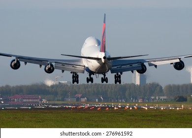 AMSTERDAM, THE NETHERLANDS--11 MAY 2015-- A Delta Airlines Boeing 747 passenger airplane is decending towards the runway. 