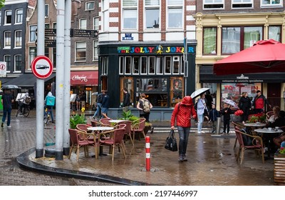 Amsterdam, North Holland, The Netherlands, 07 21 2022 - Coffeeshop At A Square In Old Town