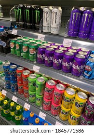 Amsterdam, North Holland / Netherlands - November 1, 2020: Soft Soda Drink Cans On Shelves/display At Convenience Store. Cherry, Pineapple, Berrry Flavoured Fanta, Monster, Sprite, Canada Dry, Welch's