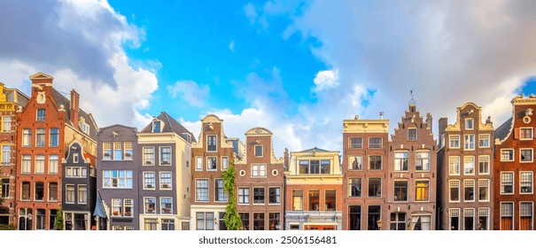 Amsterdam  Panoramic view of famous Amsterdam houses - background isolated on white. Various traditional houses in the historic center of Amsterdam. Amsterdam, Holland, Netherlands, Europe - Powered by Shutterstock