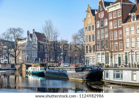 Similar – Schöne Architektur niederländischer Häuser und Hausboote am Amsterdamer Kanal im Herbst