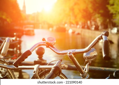 Amsterdam View With Bicycles Under Sun Light